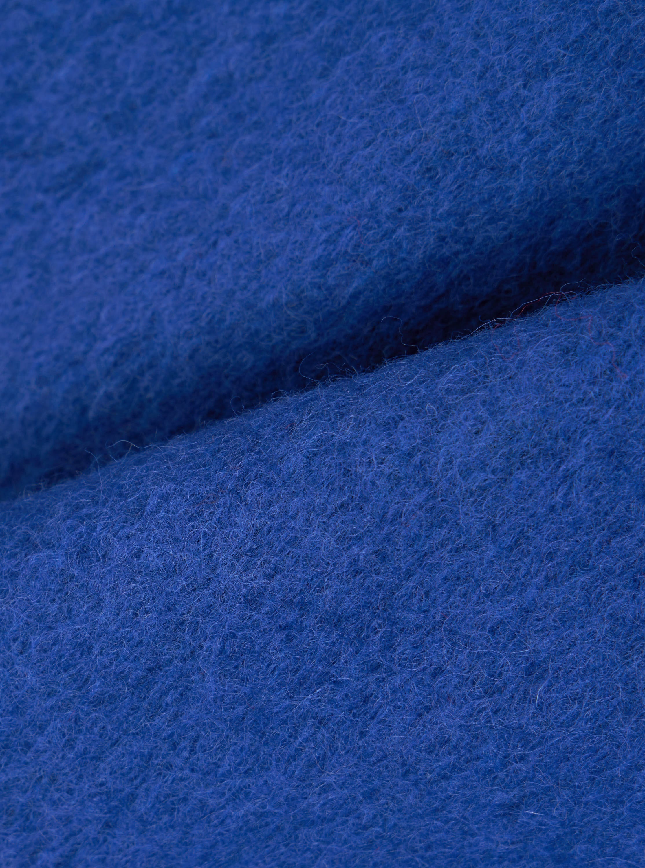 Chaleco UNIVERSAL WORKS Wool Fleece Zip Blue, detalle del tejido de lana