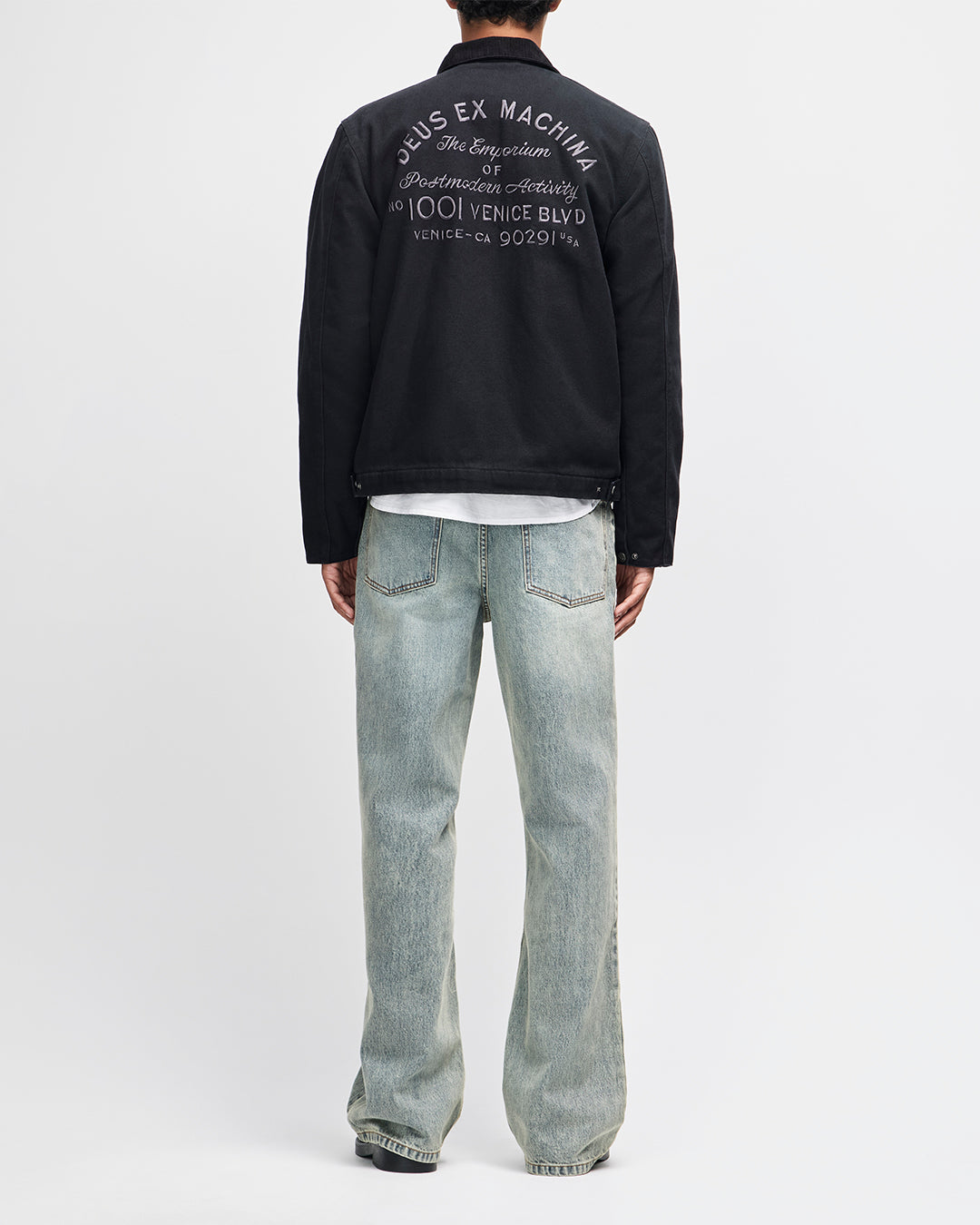 Chaqueta DEUS EX MACHINA Address Workwear negra — vista posterior con modelo