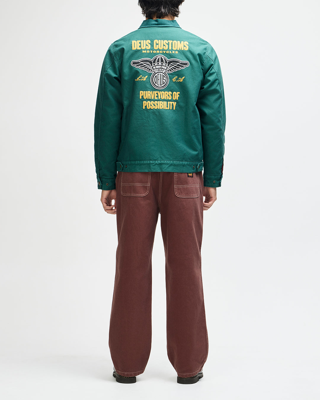 Chaqueta DEUS EX MACHINA Cutaway Racing Green — vista posterior completa con modelo