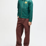 Chaqueta DEUS EX MACHINA Cutaway Racing Green — vista lateral con modelo