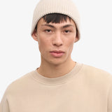 Unisex-Mütze aus recycelter Merinowolle in verblasstem Rosa