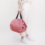 Bolsa SHUPATTO Compact M 15 L Peach, en modelo