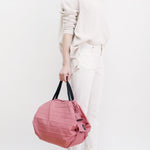 Bolsa SHUPATTO Compact M 15 L Peach, en modelo