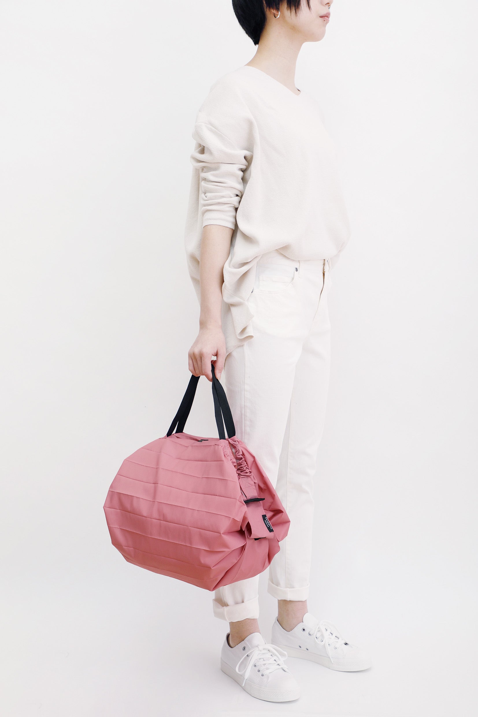 Bolsa SHUPATTO Compact M 15 L Peach, en modelo