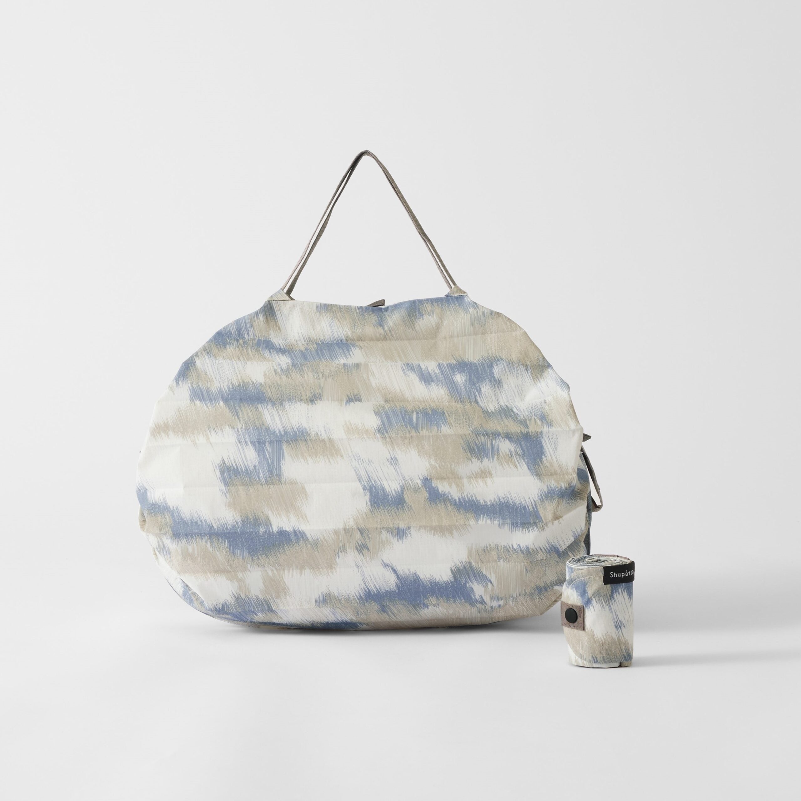 Bolsa SHUPATTO Compact M 15 L Floating Clouds, plegada