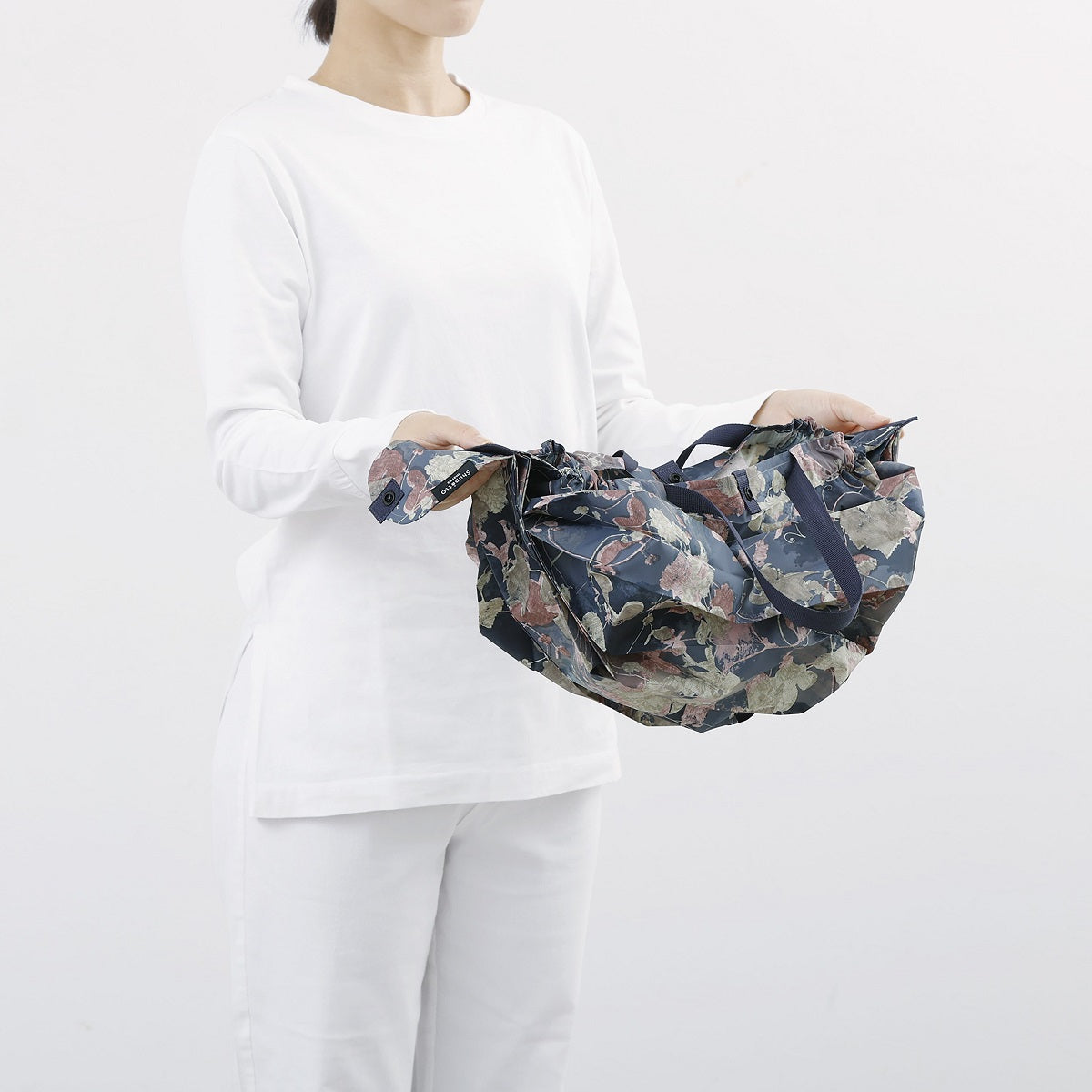 Bolsa SHUPATTO Recycled Compact M 15 L Ivy Leaves, detalle de plegado