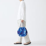 Bolsa SHUPATTO Recycled Compact M 15 L Sea Shells, en modelo