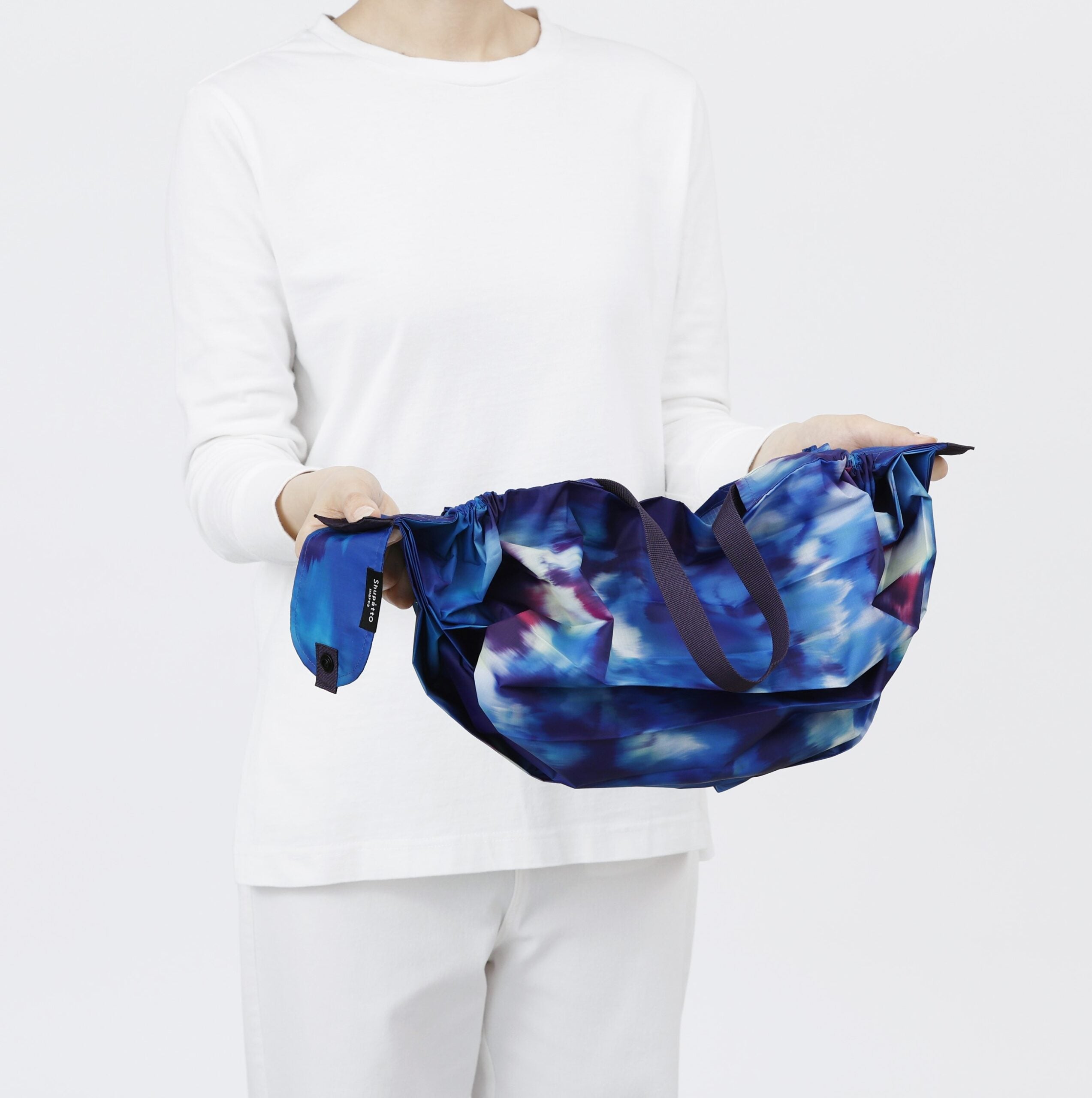 Bolsa SHUPATTO Recycled Compact M 15 L Sea Shells, detalle de plegado
