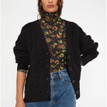 Cardigan de punto con botones y detalle de ochos negro - ECRU