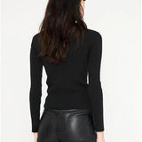 Jersey ajustado de punto canalé con cuello alto y manga larga negro - ECRU