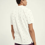 Polo de piqué de algodón orgánico con diseño estampado - ECRU