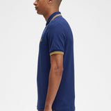Polo Fred Perry M3600 Azul marino francés Hora dorada - ECRU