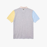 Polo unisex Lacoste L!VE relaxed fit en piqué de algodón con diseño color block - ECRU