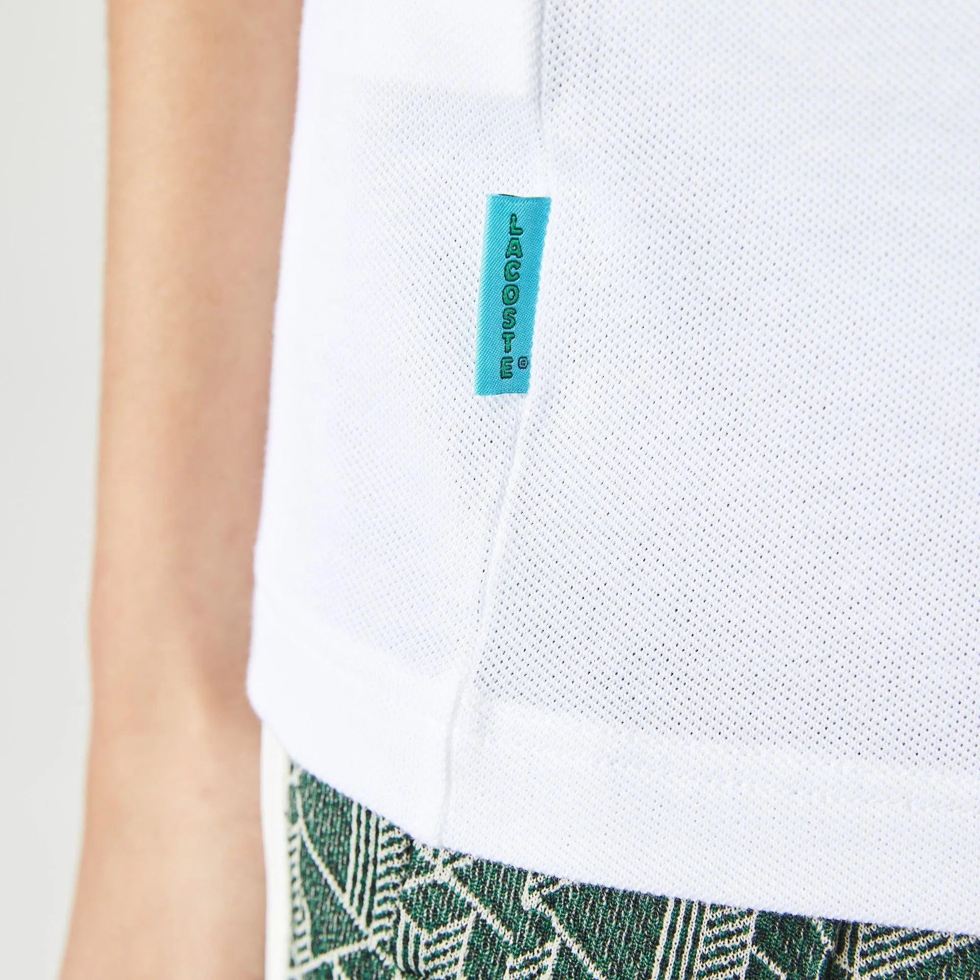 Polo unisex Lacoste L!VE relaxed fit en piqué de algodón stretch - ECRU