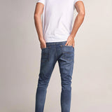 VAQUEROS KARL LOOSE SLIM CON DESGASTE - ECRU